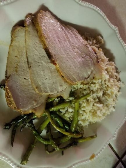 Roast Pork Loin with Pepper Jelly plated with rice and green beans