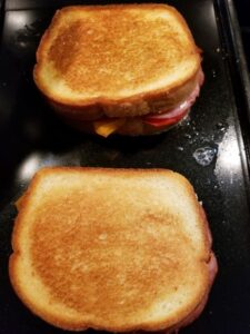 Italian Grilled Cheese Sandwiches cooking on the griddle pan