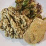 Pork Chops in Mustard Sauce plated with wild rice and roasted brussels sprouts