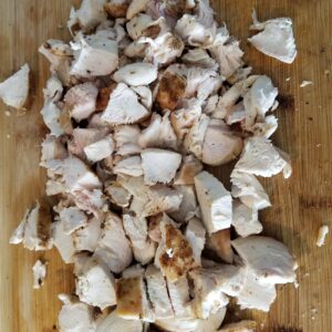 Chipotle Turkey Master Mix - Cooked and chopped meat on a wood cutting board.